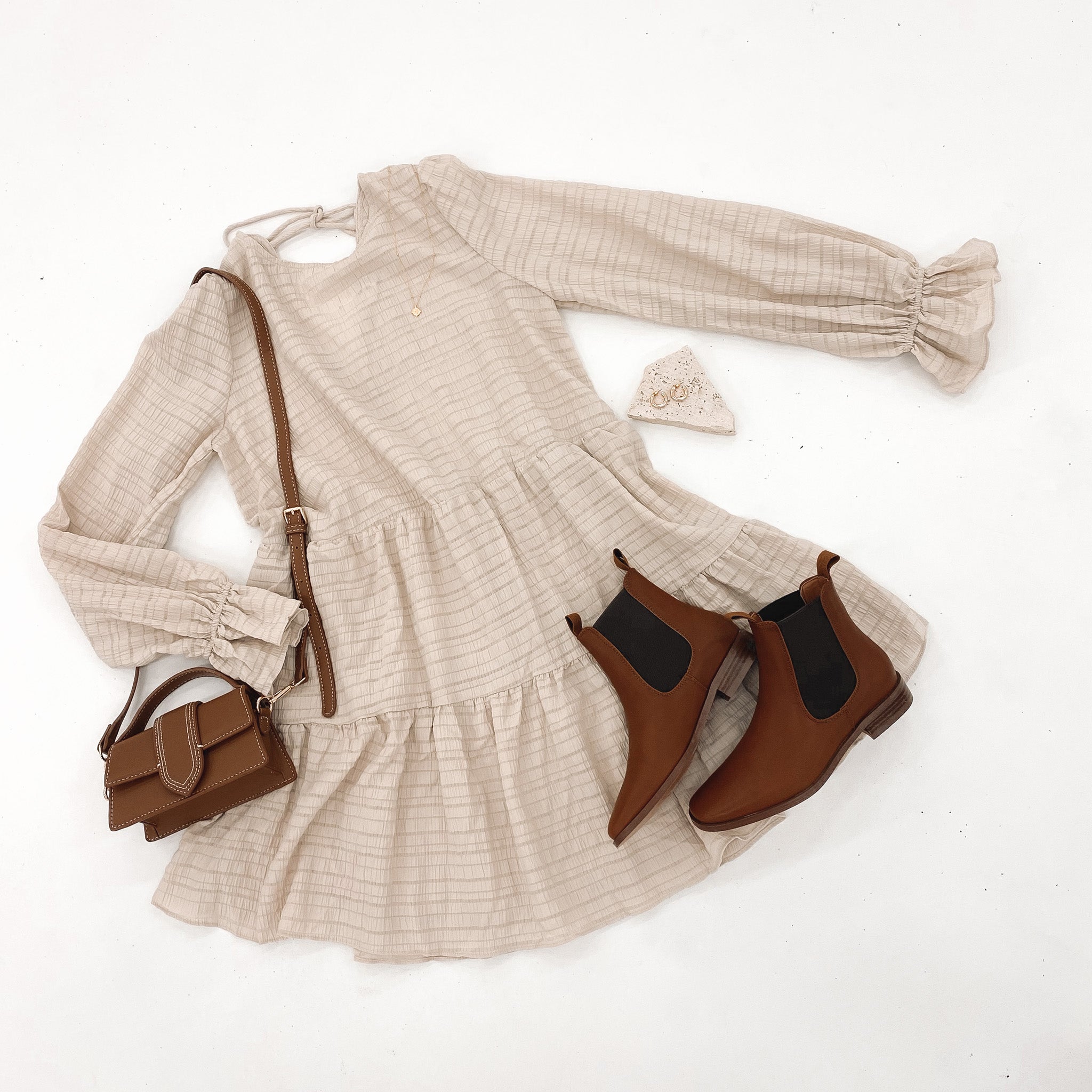 How stunning is the 'Harlet Mini Dress Beige'!